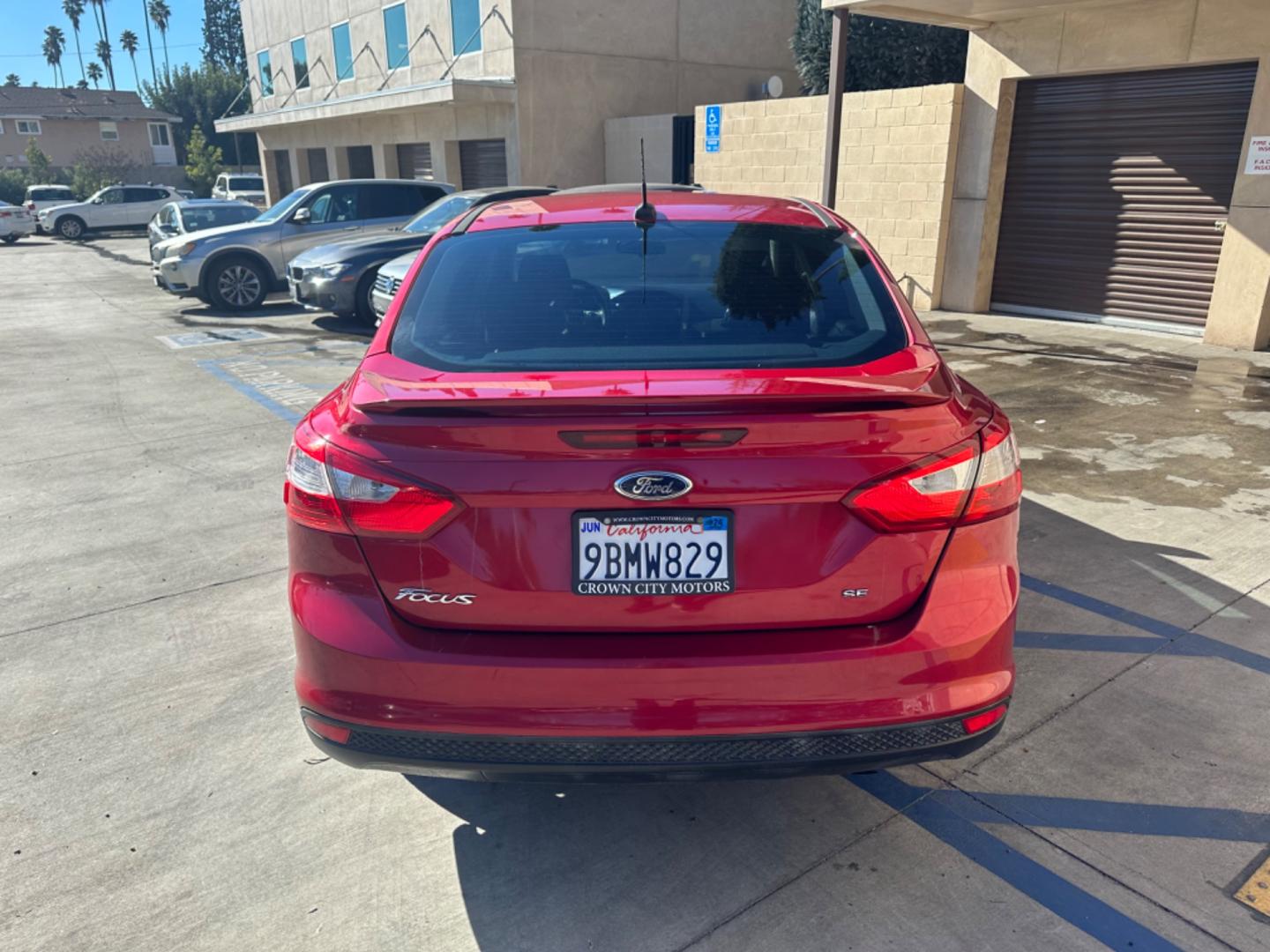 2012 RED /BLACK Ford Focus SE Sedan (1FAHP3F29CL) with an 2.0L L4 DOHC 16V engine, AUTOMATIC transmission, located at 30 S. Berkeley Avenue, Pasadena, CA, 91107, (626) 248-7567, 34.145447, -118.109398 - New Tires! Nice Interior! drives and looks good! Bad credit? We can help! We are the bank. All our cars are thoroughly inspected and reconditioned by our technicians. FREE CARFAX report. Stop by or call to speak with our friendly staff. Whether you have bad credit, no credit, bankruptcy, or reposse - Photo#3